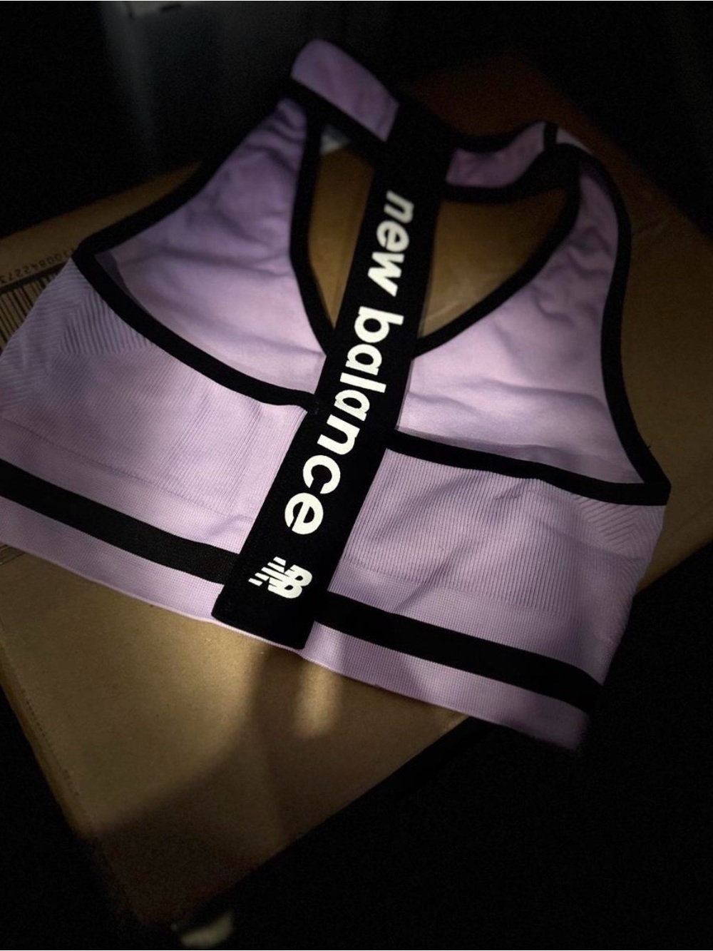 New Balance Lavender Sports Bra with Black Trim and Branded Back Strap